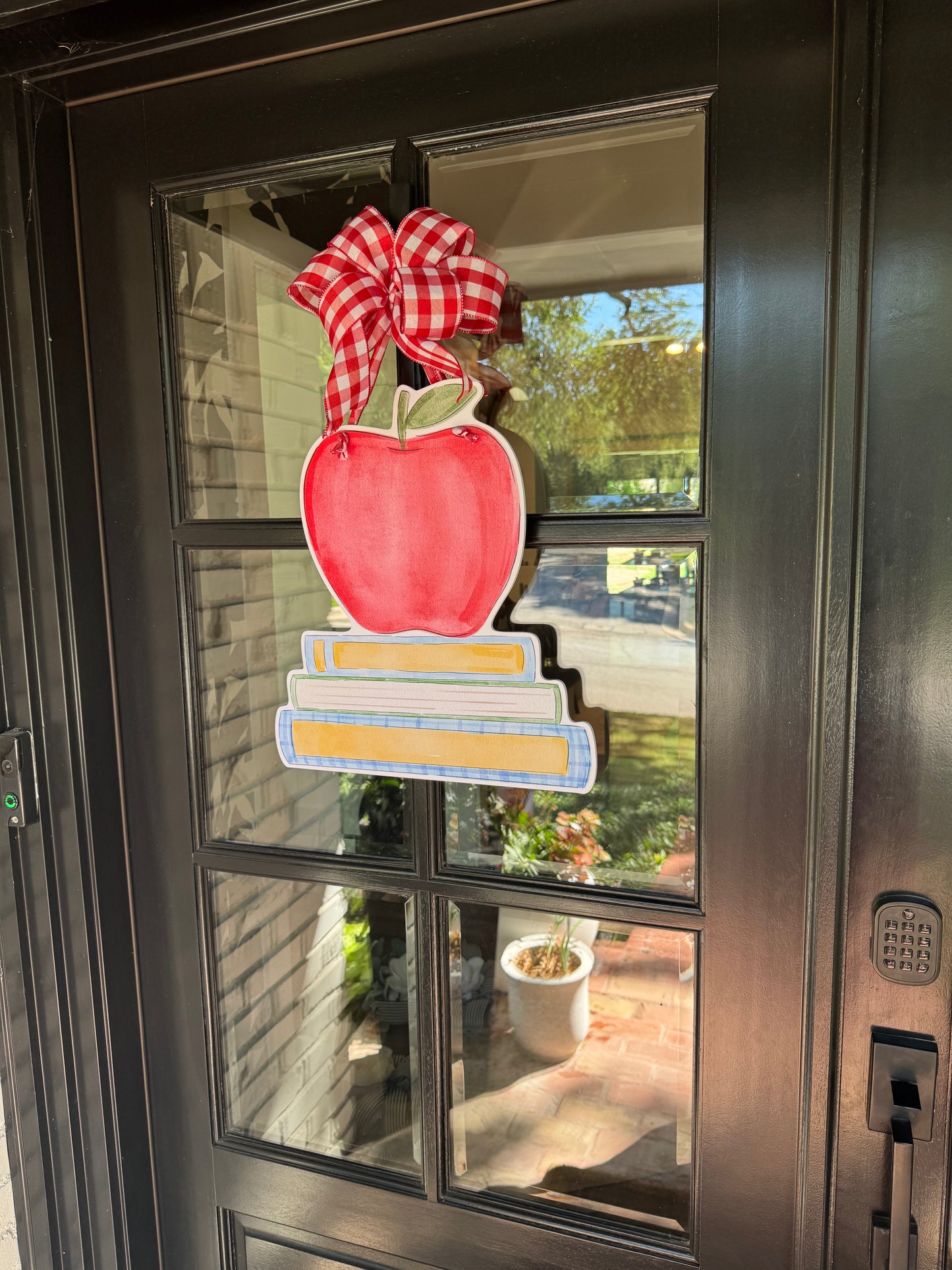 The Apple Book Stack Door Hanger